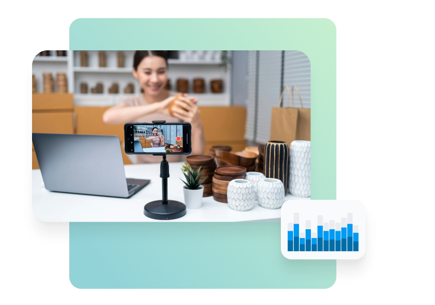 Graphic showing a woman recording a product video with a smartphone on a tripod, with a laptop and small product items on a table, plus a small bar chart icon indicating analytics.